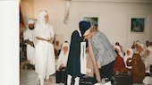 Jathedar Manjit Singh (Sikh High Priest) honors Dr. Noel King at Nanak Dwara Asharam, Phoenix, Arozona. The Sikh congregation is seen. Phoenix, Arizona, January 1999