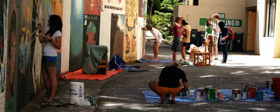 Students painting moat murals